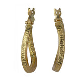 Aretes Huggie con llave griega en oro amarillo de 18 k