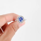 18K White Gold Blue Sapphire Center And Diamond Halo Cocktail Ring