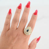 Anillo de cóctel con halo de diamantes de talla pera y zafiro de oro amarillo de 14 quilates