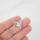 Colgante de dos corazones con diamantes en oro blanco de 18 quilates