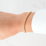 Brazalete de tenis con eslabones en S y diamantes en oro amarillo de 14 quilates