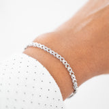 Pulsera de tenis con eslabones infinitos y engaste de diamantes de ilusión de oro macizo blanco de 10 quilates